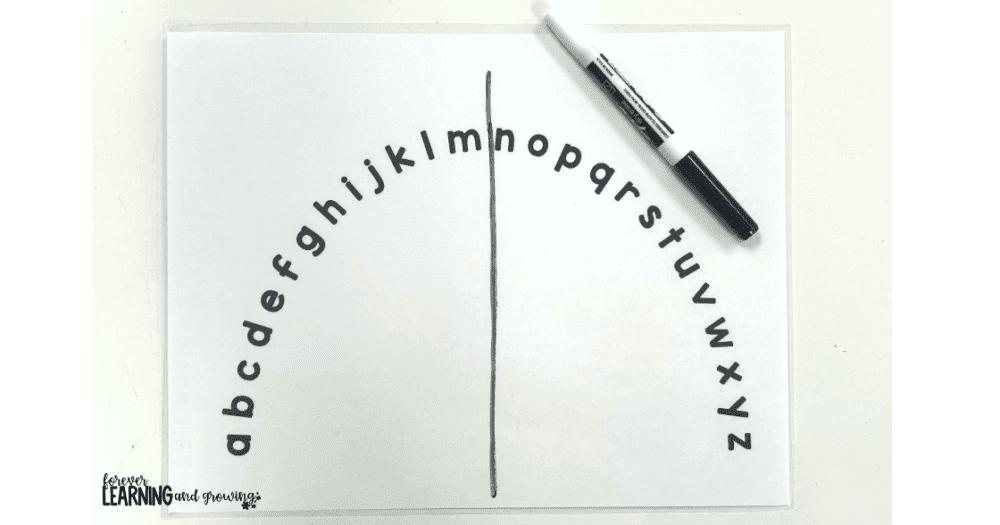 an alphabet arc with a line drawn down the middle for helping with how to teach abc order