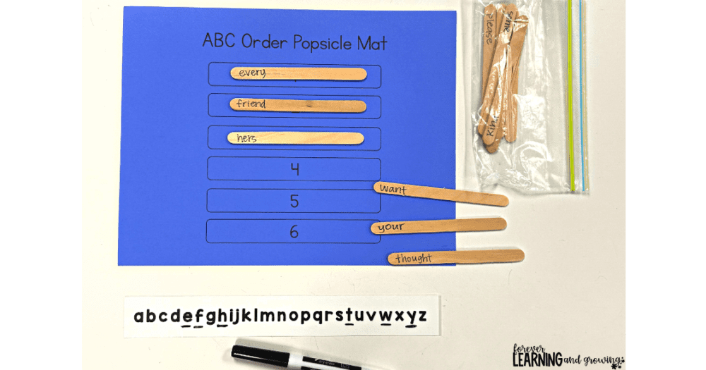 an activity for how to teach abc order- popsicle sticks with words on them and an alphabet strip used to put words in order