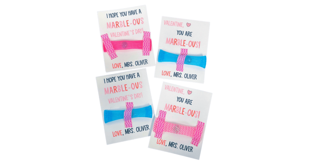 A Valentine's Day gift idea for students consisting of a set of cards with marble fidget taped on that say "Have a Marble-ous Valentine's Day" or "I think you're Marble-ous"