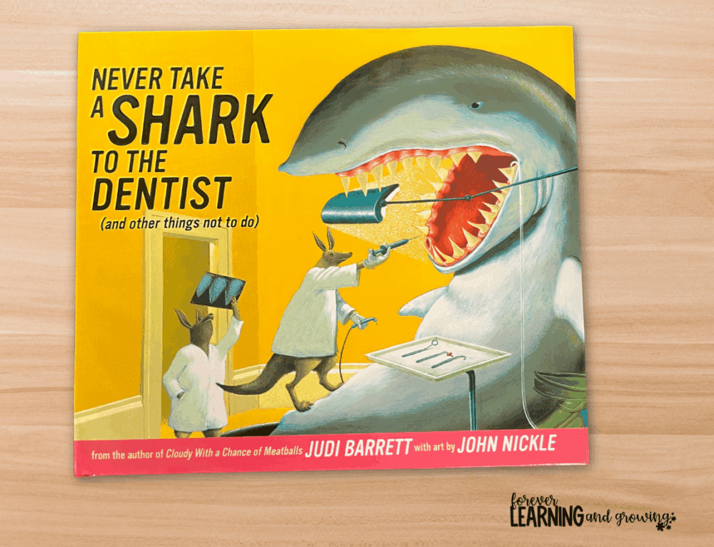 book called "Never Take a Shark to the Dentist" on a desk
